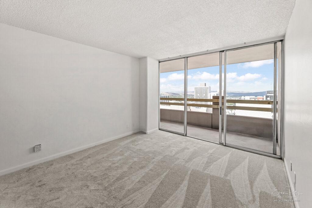Bedroom view with windows