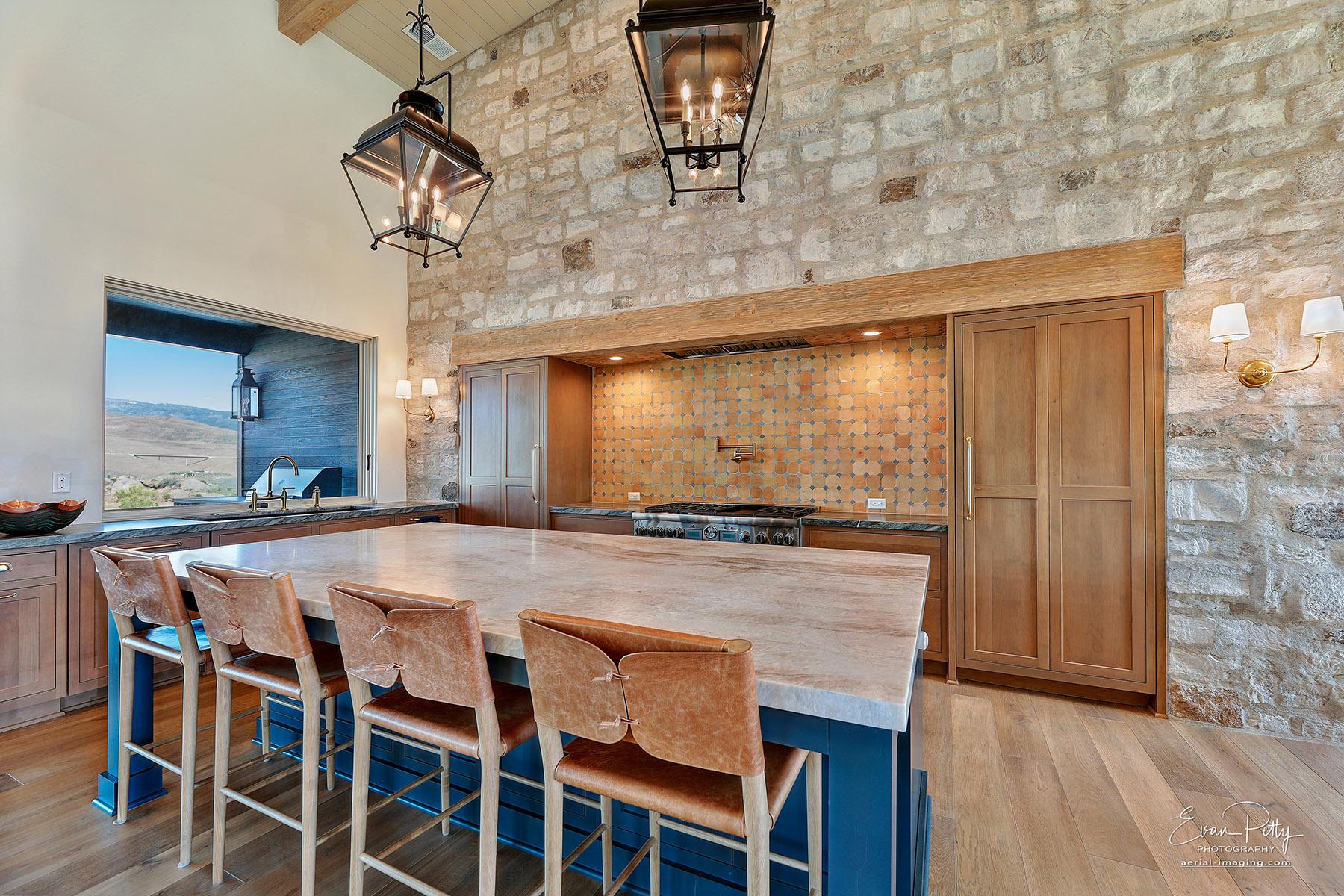 Kitchen seating around the granite island.