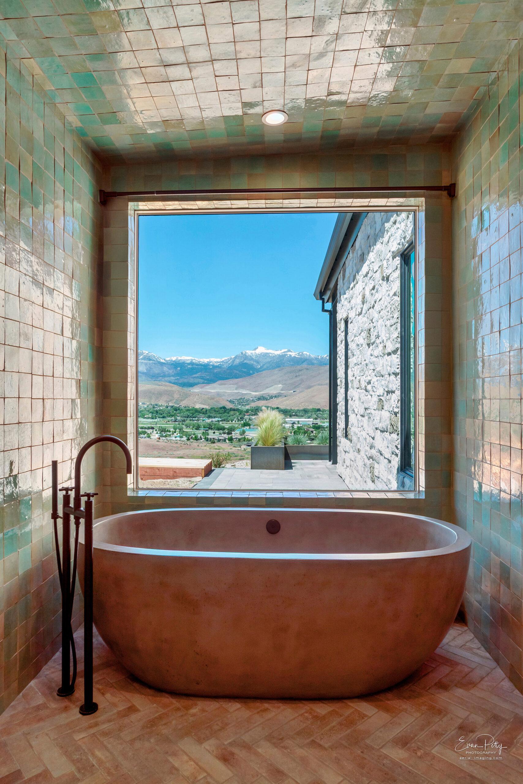 Incredible view from the bathtub looking at the mountains.