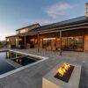 Back of house with swimming pool area.