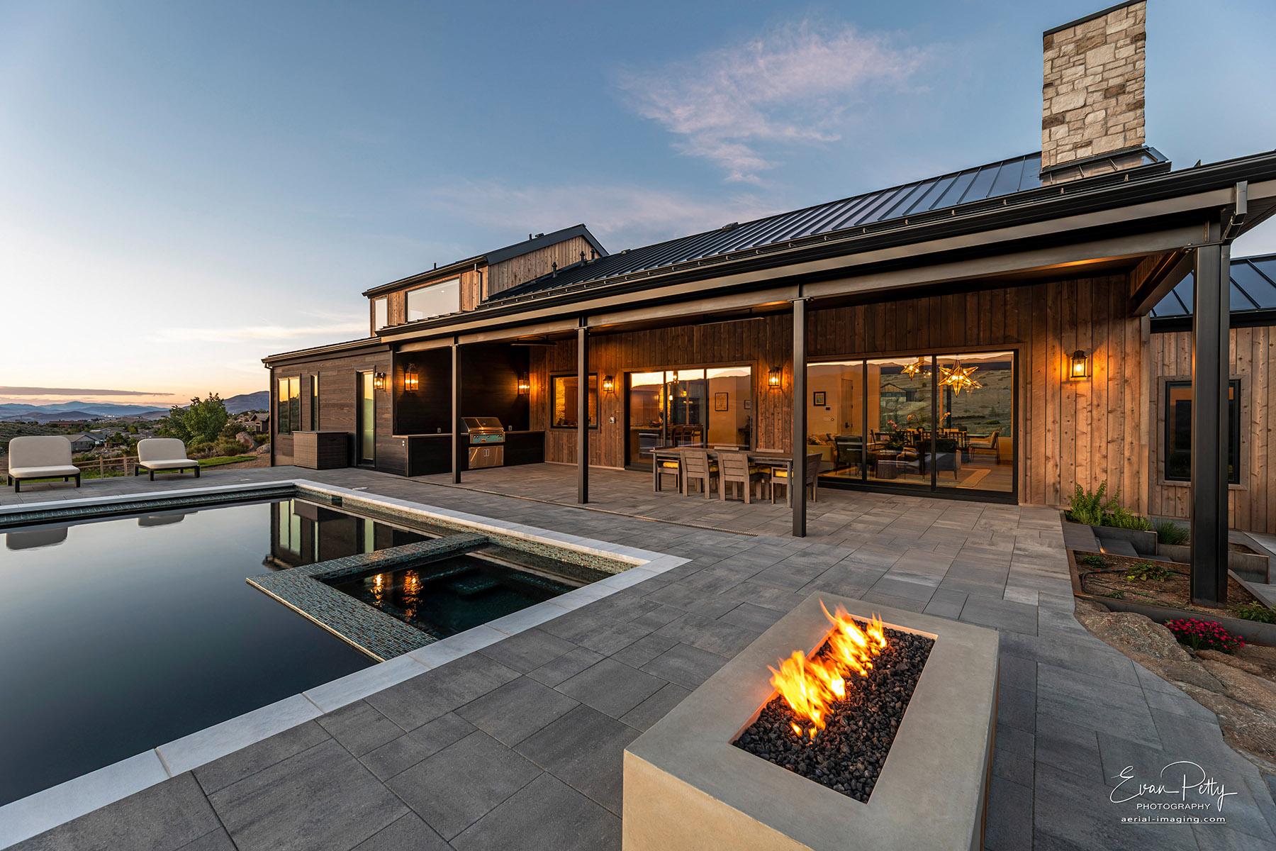 Back of house with swimming pool area.