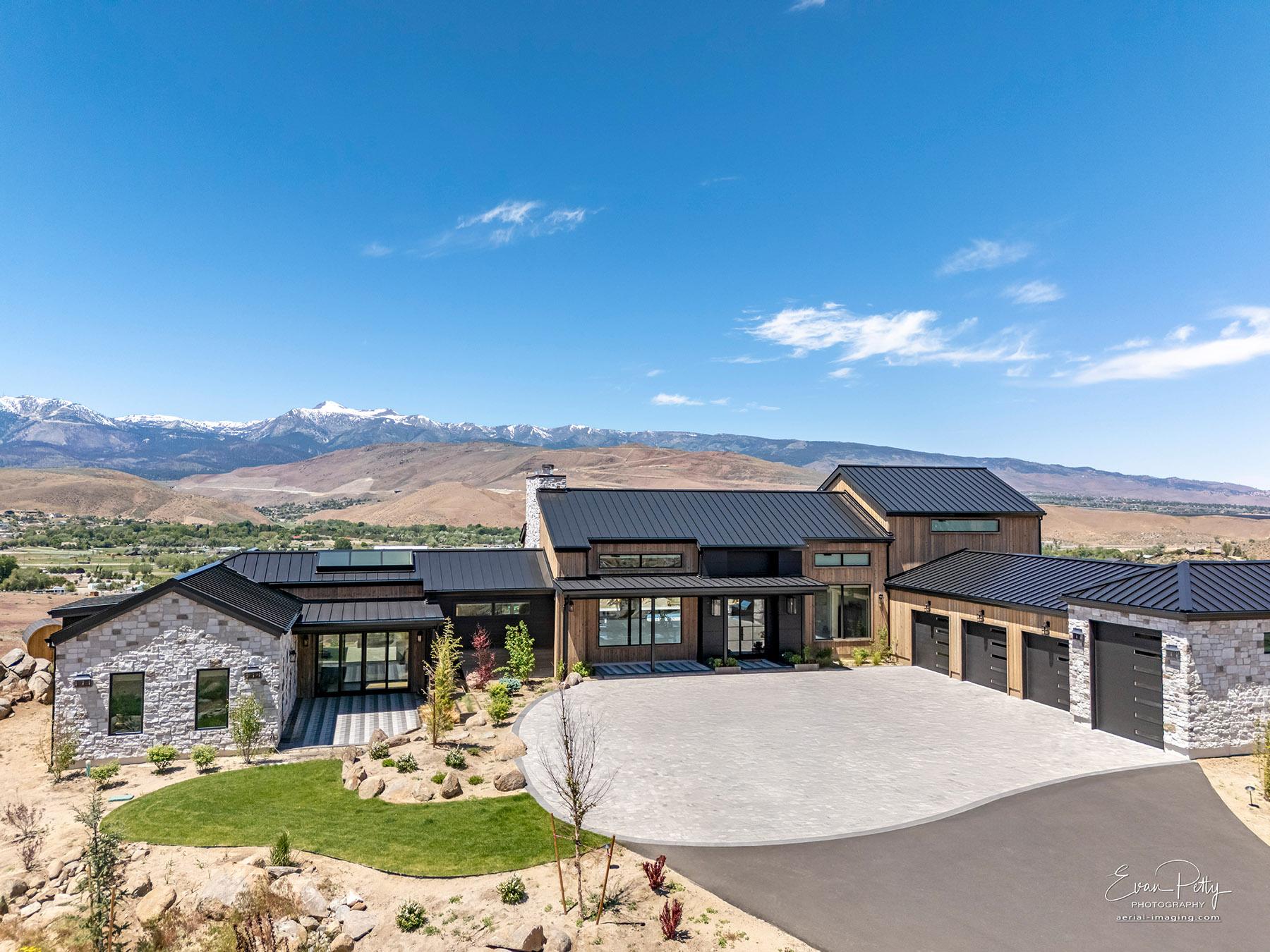 Drone view of the driveway and front of the house.